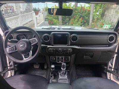Sahara interior showing the touchscreen, automatic shifter and air conditioning controls