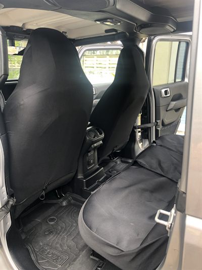 Rear bench and front seats of the Sahara, fitted with protective seat covers